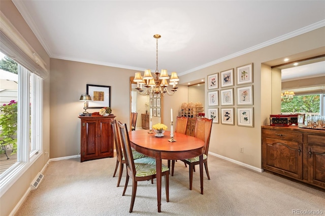 dining room featuring plenty of natural light, light colored carpet, and a notable chandelier