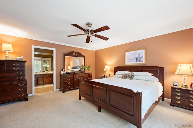 carpeted bedroom featuring ornamental molding, ceiling fan, and ensuite bathroom