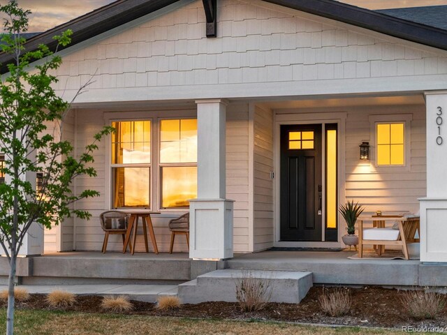 doorway to property featuring covered porch