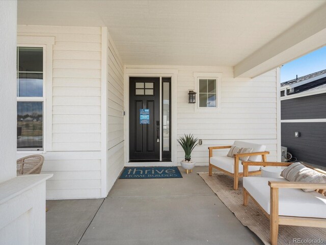 doorway to property featuring a porch