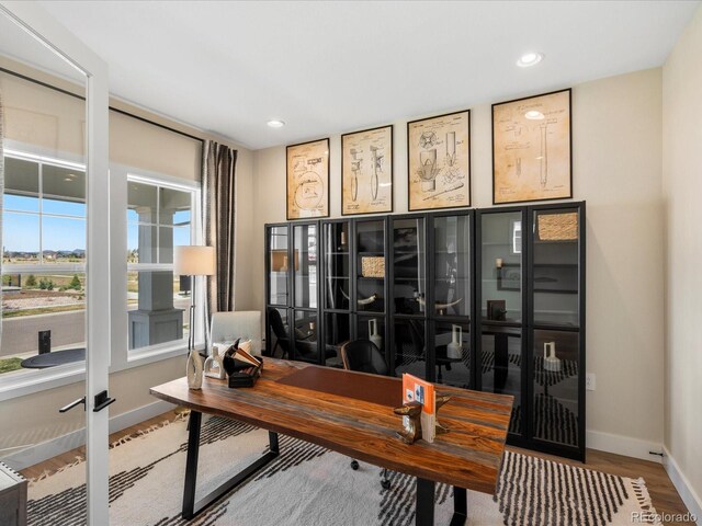 home office with baseboards, recessed lighting, and wood finished floors