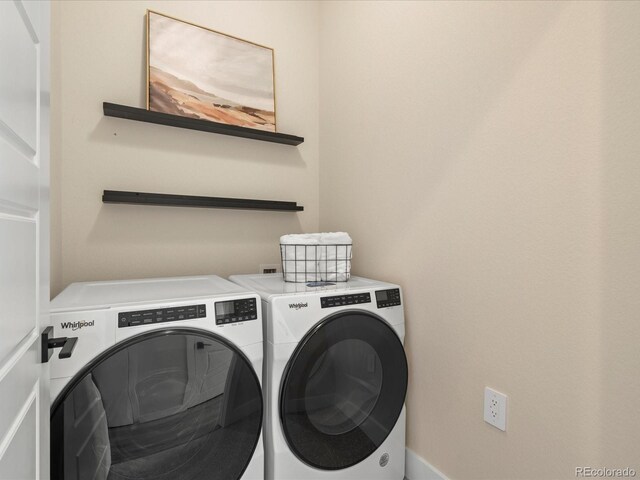 laundry area with separate washer and dryer and laundry area