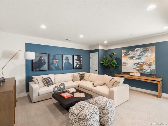carpeted living room with recessed lighting, baseboards, and visible vents