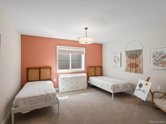 bedroom featuring light carpet