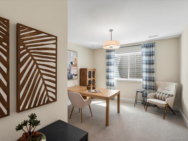 carpeted office featuring baseboards and visible vents