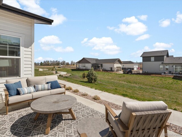 view of patio / terrace with an outdoor living space and a residential view