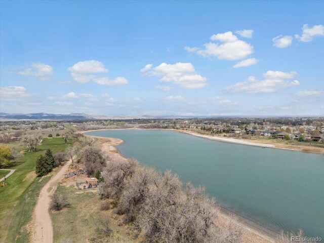 bird's eye view with a water and mountain view