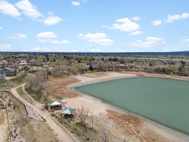 aerial view with a water view and a residential view