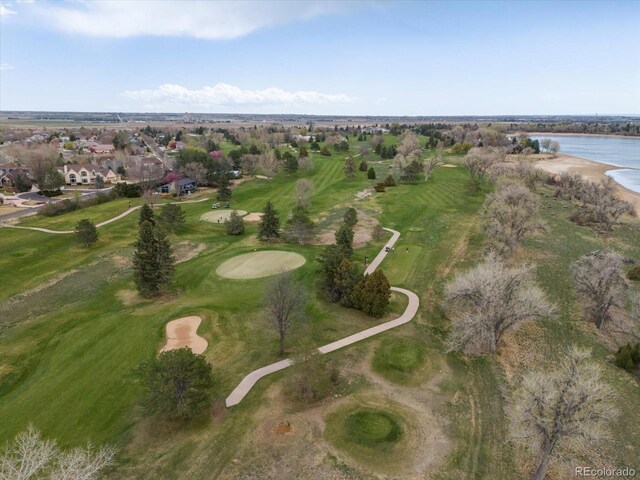 birds eye view of property with a water view, view of golf course, and a residential view