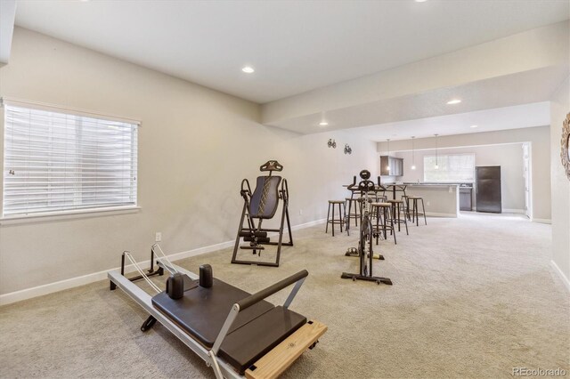 workout room featuring light colored carpet, baseboards, and recessed lighting