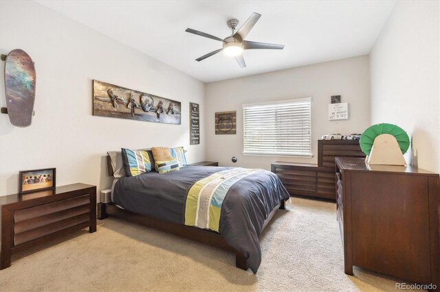 carpeted bedroom with ceiling fan