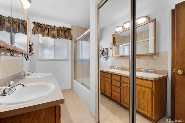 bathroom with vanity, tile patterned floors, and shower / bath combination with glass door