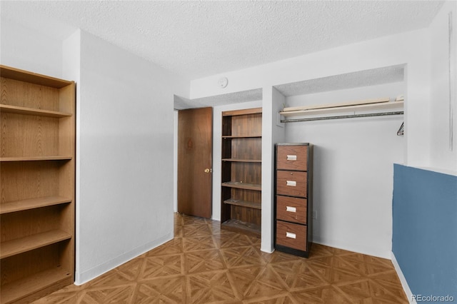 spacious closet with parquet floors