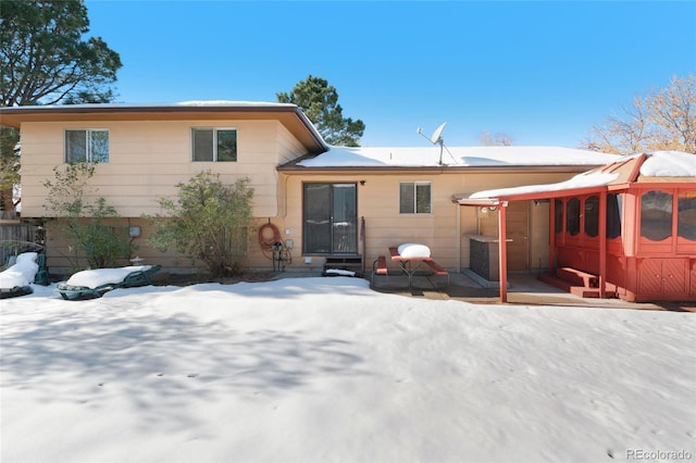 view of snow covered house