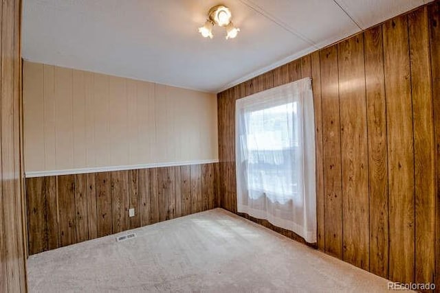 empty room featuring wooden walls