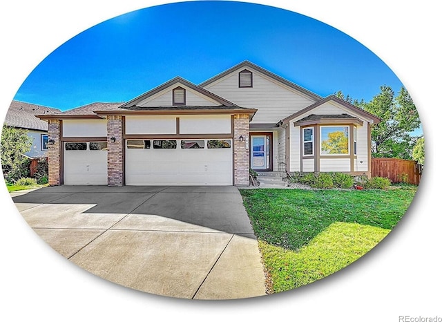 view of front facade featuring a front yard and a garage