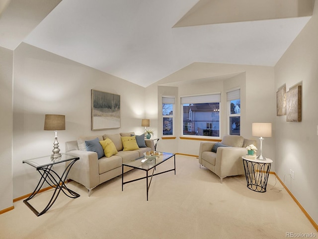 living room featuring light colored carpet and lofted ceiling