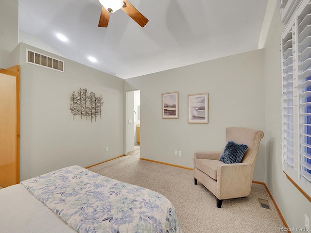 bedroom with light colored carpet, vaulted ceiling, and ceiling fan