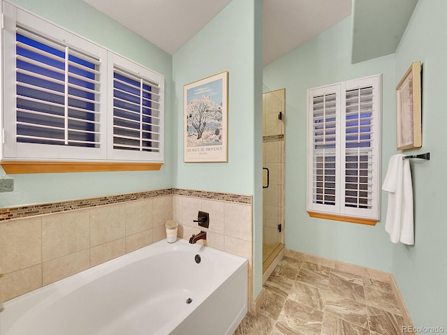 bathroom with plus walk in shower and vaulted ceiling