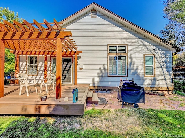 rear view of property with a pergola and a deck