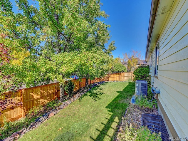 view of yard with central AC unit