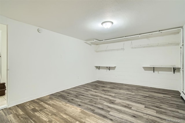 interior space with hardwood / wood-style floors and a textured ceiling