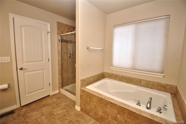 bathroom featuring plus walk in shower