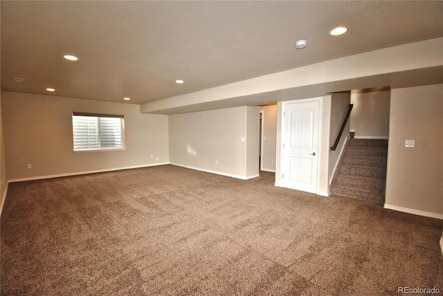 empty room featuring dark colored carpet