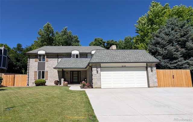 8129 S Yukon St S, Littleton, CO 80128 - view of front of home with an attached garage, roof with shingles, concrete driveway, a chimney, and brick siding