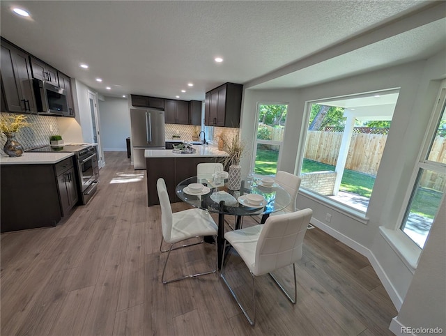 8129 S Yukon St S, Littleton, CO 80128 - dining space with recessed lighting and wood finished floors