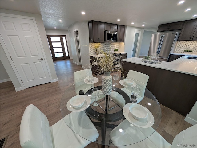 8129 S Yukon St S, Littleton, CO 80128 - dining space featuring wood finished floors and recessed lighting
