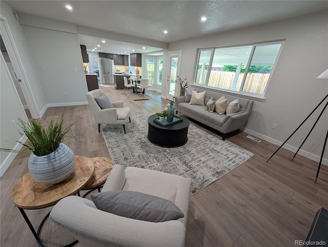 8129 S Yukon St S, Littleton, CO 80128 - living area featuring light wood-style flooring and recessed lighting