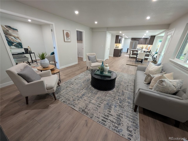 8129 S Yukon St S, Littleton, CO 80128 - living room featuring light wood-type flooring and recessed lighting