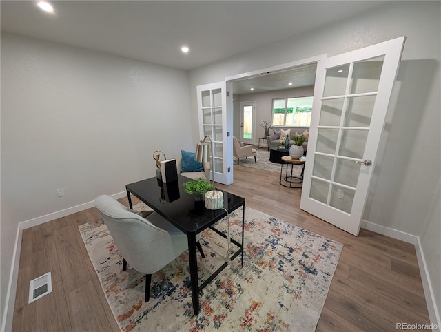 8129 S Yukon St S, Littleton, CO 80128 - sitting room featuring french doors, wood finished floors, recessed lighting, and a desk