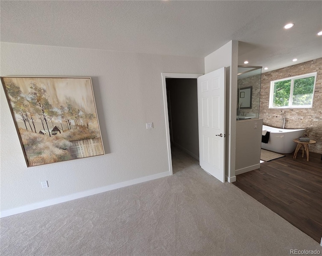 8129 S Yukon St S, Littleton, CO 80128 - carpeted empty room featuring recessed lighting and wood finished floors