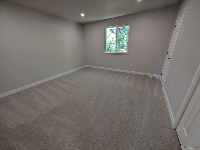 8129 S Yukon St S, Littleton, CO 80128 - spare room featuring light carpet and recessed lighting