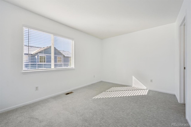 unfurnished room with carpet floors