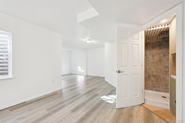 empty room with light hardwood / wood-style floors