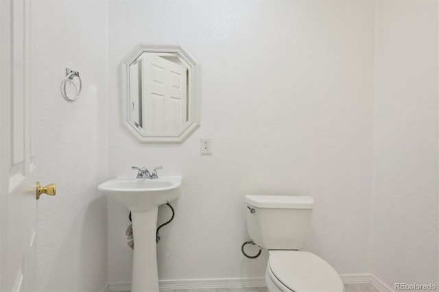 bathroom featuring toilet