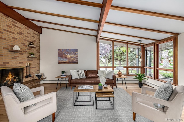 living room with wood finished floors, a fireplace, baseboards, a baseboard radiator, and lofted ceiling with beams