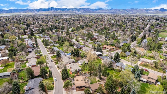 drone / aerial view featuring a residential view and a mountain view