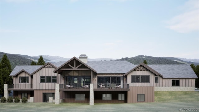 967 W Elk Meadows Dr, Tabernash, CO 80446 - rear view of property featuring a mountain view, a lawn, a chimney, and a balcony