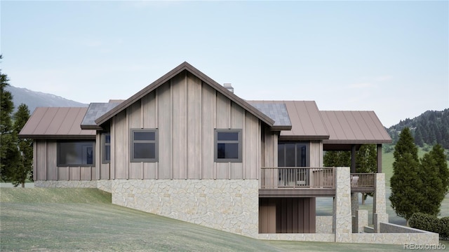 967 W Elk Meadows Dr, Tabernash, CO 80446 - view of side of home with a mountain view and board and batten siding