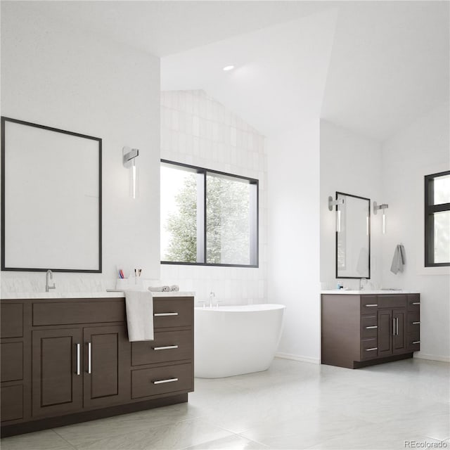 967 W Elk Meadows Dr, Tabernash, CO 80446 - full bath featuring two vanities, lofted ceiling, and a freestanding tub