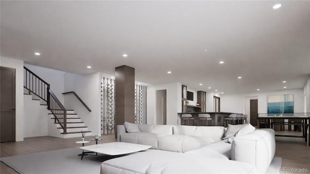 967 W Elk Meadows Dr, Tabernash, CO 80446 - living area featuring wood finished floors, stairway, and recessed lighting