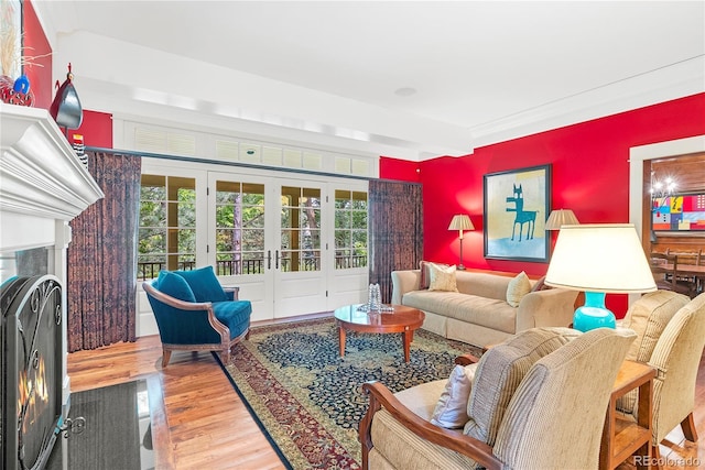living room with wood finished floors and french doors