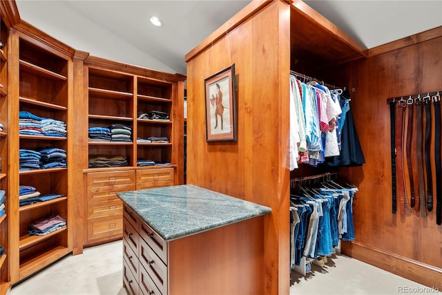walk in closet featuring lofted ceiling