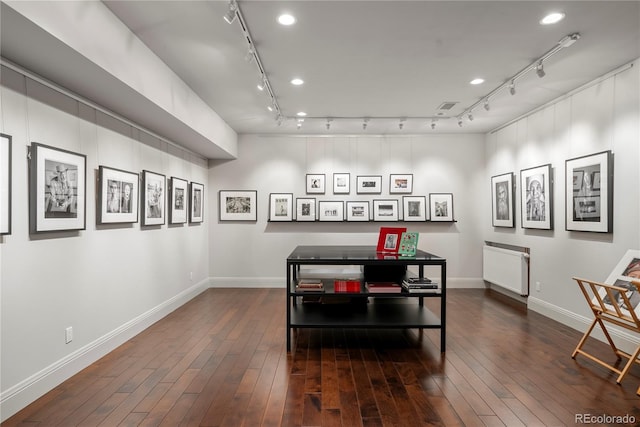 dining area with track lighting, baseboards, dark wood-type flooring, and visible vents