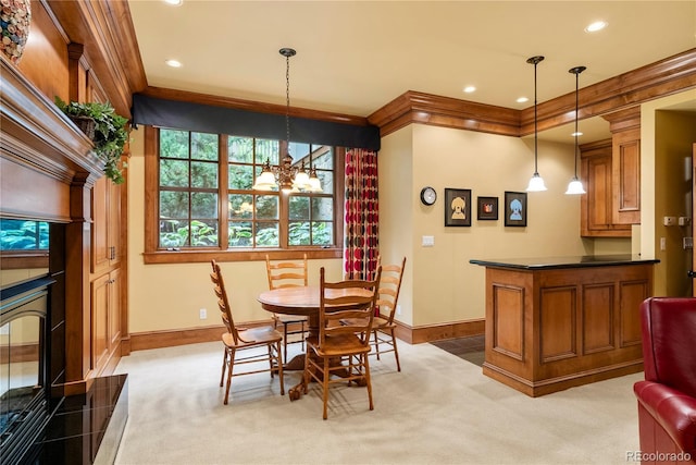 carpeted dining area featuring baseboards, recessed lighting, a notable chandelier, and ornamental molding