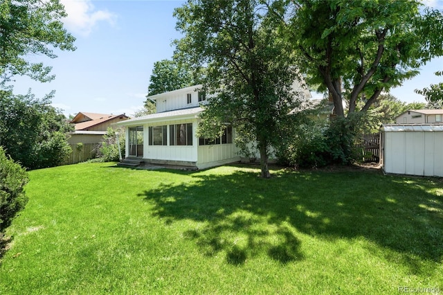 4184 S Syracuse St, Denver, CO 80237 - view of yard with a sunroom, a shed, and entry steps